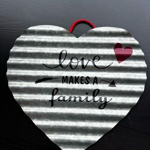 Heart-Shaped Corrugated Metal Sign "Love Makes a Family" - Gray & Red